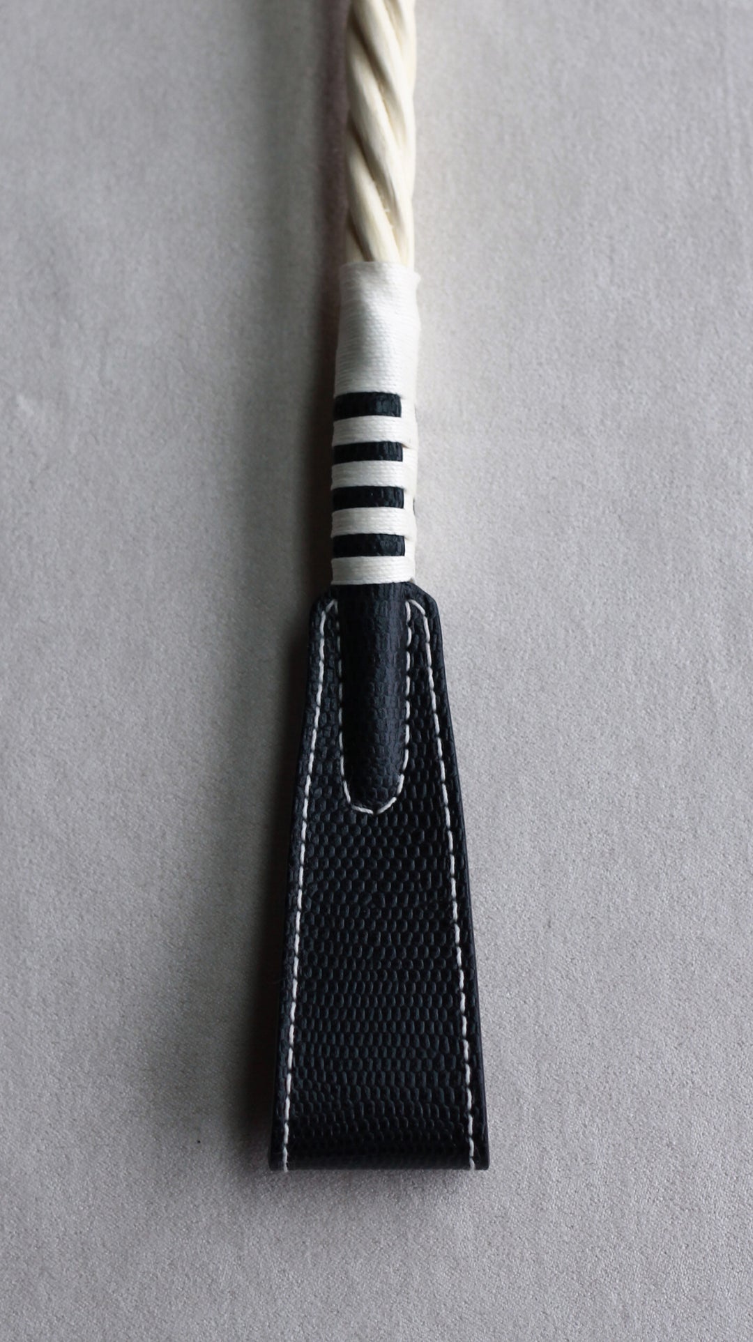 paddle riding crop black